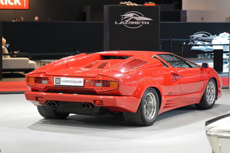 Named to honour the company's twenty-fifth anniversary in 1988, the 25th Anniversary Countach, although mechanically very similar to the 5000QV, sported considerable restyling done by Horacio Pagani. The Lamborghini Countach is a rear mid-engine, rear-wheel-drive sports car produced by the Italian automobile manufacturer Lamborghini from 1974 until 1990. It is one of the many exotic designs developed by Italian design house Bertone, which pioneered and popularized the sharply angled "Italian Wedge" shape. Named to honour the company's twenty-fifth anniversary in 1988, the 25th Anniversary Countach, although mechanically very similar to the 5000QV, sported considerable restyling done by Horacio Pagani. The Lamborghini Countach is a rear mid-engine, rear-wheel-drive sports car produced by the Italian automobile manufacturer Lamborghini from 1974 until 1990. It is one of the many exotic designs developed by Italian design house Bertone, which pioneered and popularized the sharply angled "Italian Wedge" shape.