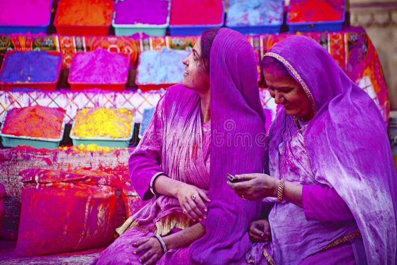 JAIPUR, INDIA - MARCH 17: Lady in violet, covered in paint on Holi festival, March 17, 2013, Jaipur, India. Holi, the festival o