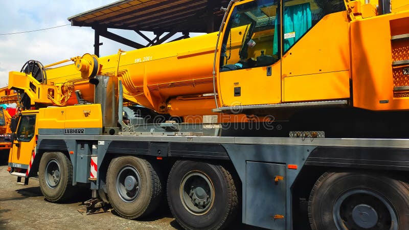 Jakarta, Indonesia - June 3, 2022: Yellow 200 Tons mobile telescopic crane in Jakarta