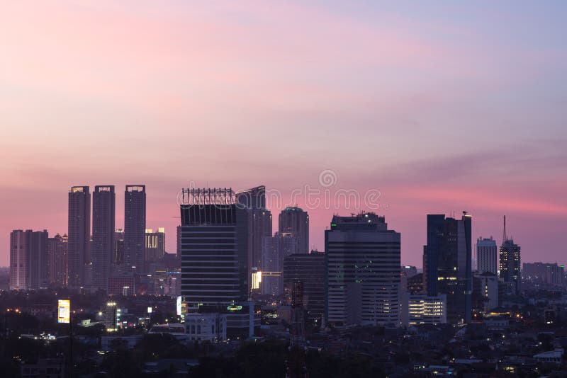 Jakarta sunset stock image. Image of buildings, purple - 62956325