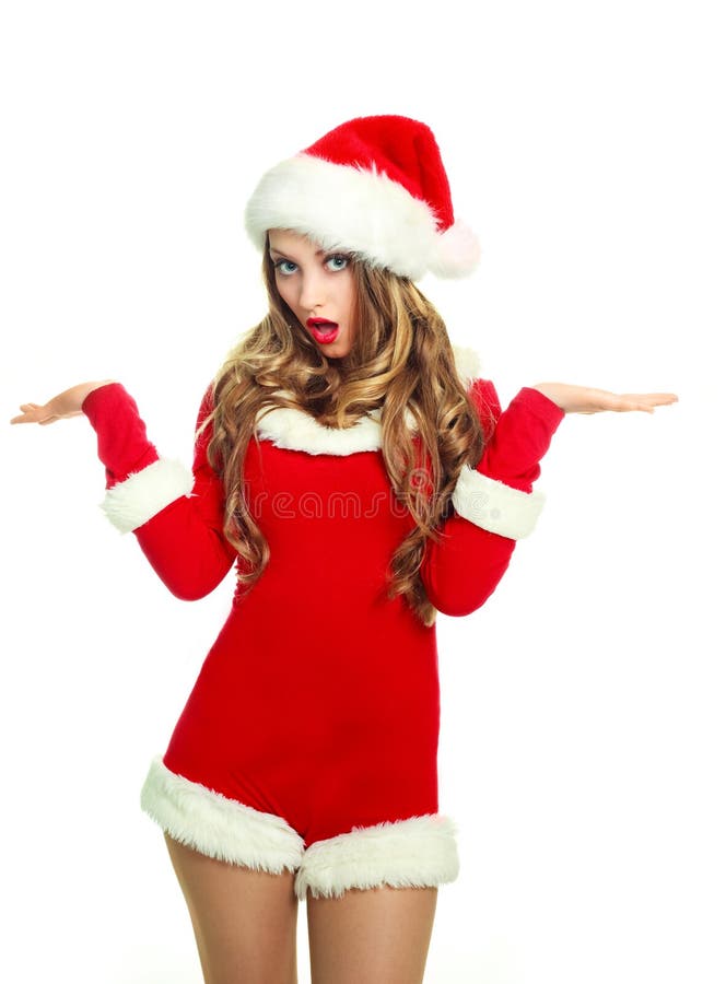 Portrait of a surprised young woman dressed as Santa against white background. Portrait of a surprised young woman dressed as Santa against white background