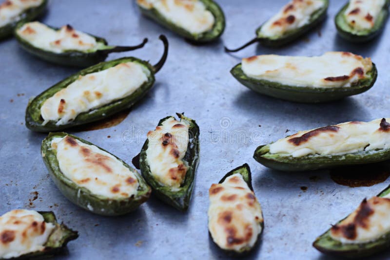 Shot of a tray of jalapeno stuffed and baked. Shot of a tray of jalapeno stuffed and baked