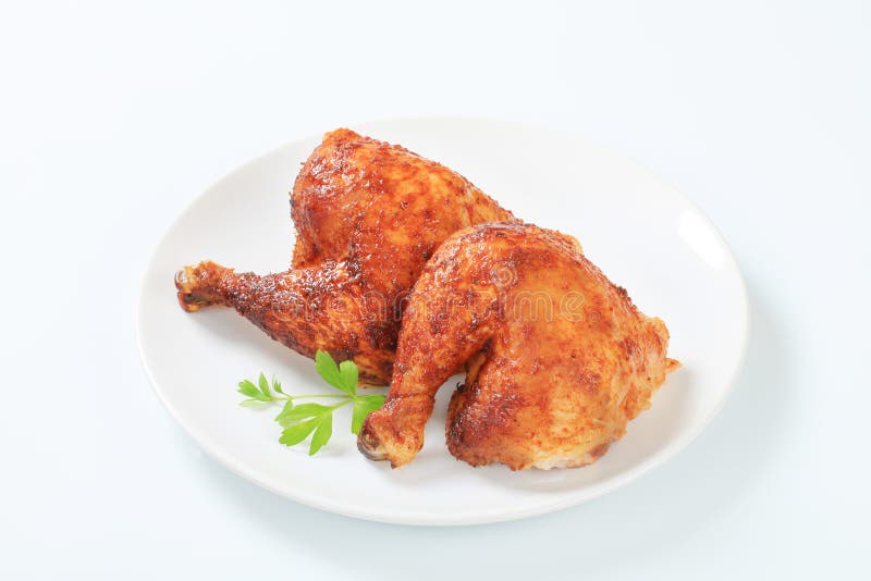 Jambes de poulet rôties par ail images libres de droits Jambes de poulet rôties par ail images libres de droits