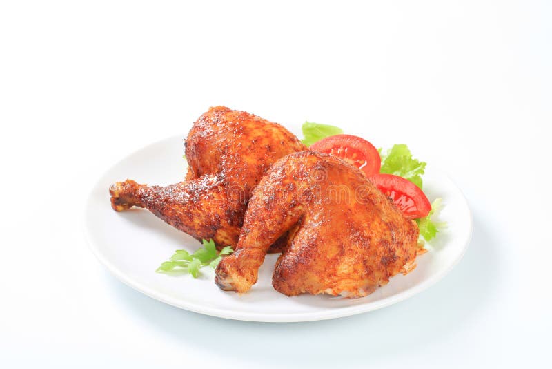Jambes de poulet rôties par ail image libre de droits Jambes de poulet rôties par ail image libre de droits