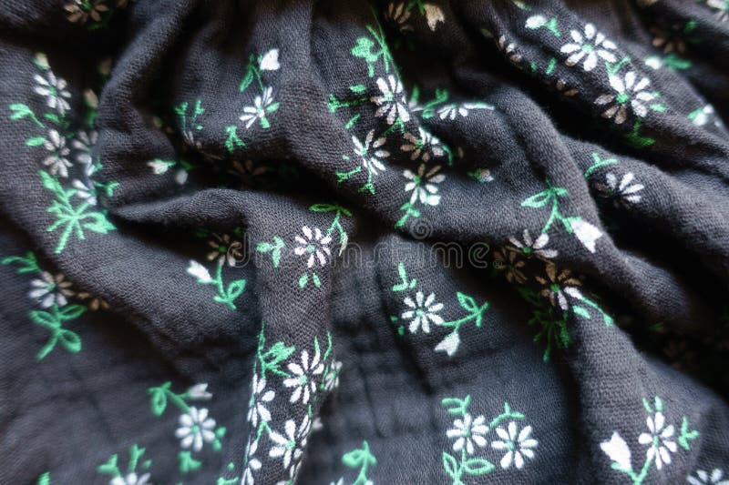 Jammed black muslin fabric with floral print stock photos