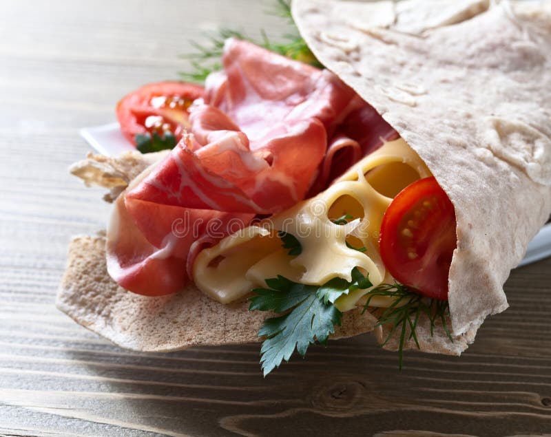 Jamon with cheese, tomatoes and greens