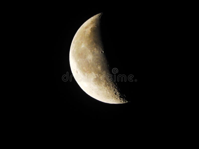 40% illuminated Waning Crescent moon in sky royalty free stock photography