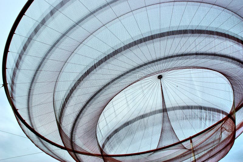 Janet Echelman`s public network sculpture in roundabout, Matosinhos royalty free stock photography Janet Echelman`s public network sculpture in roundabout, Matosinhos royalty free stock photography