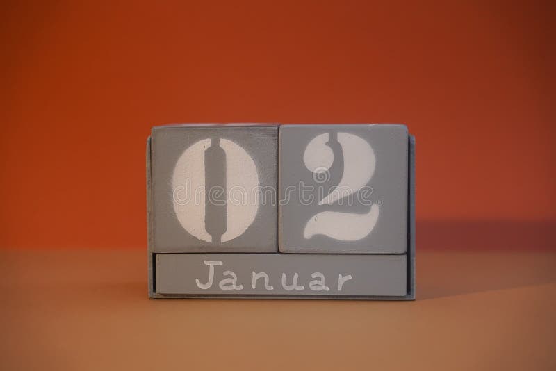 2 Januar on wooden grey cubes. Calendar cube date 02 January. Concept of date. Copy space for text or event. Educational cubes. Cube shape calendar for January 2 with empty space. Selective focus. 2 Januar on wooden grey cubes. Calendar cube date 02 January. Concept of date. Copy space for text or event. Educational cubes. Cube shape calendar for January 2 with empty space. Selective focus