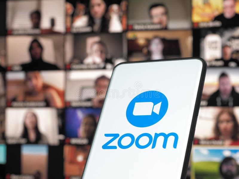 11 January 202 - Bucharest, Romania: Smartphone starting Zoom Cloud Meetings app with meeting on a background monitor. royalty free stock photography