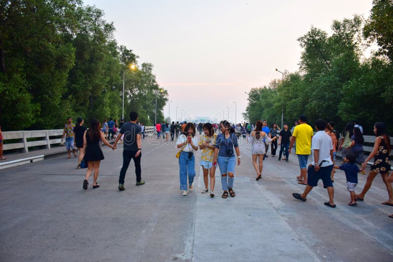 January 21, 2018 - Samut Prakan, Thailand, 3 girlfriends walk around on the corridor in the middle of the road. January 21, 2018 - Samut Prakan, Thailand, 3 girlfriends walk around on the corridor in the middle of the road.