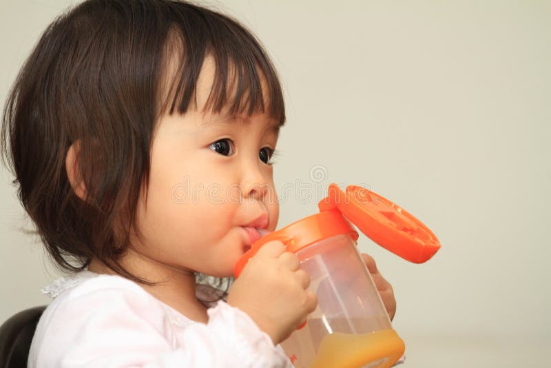 Japanese baby girl drinking water