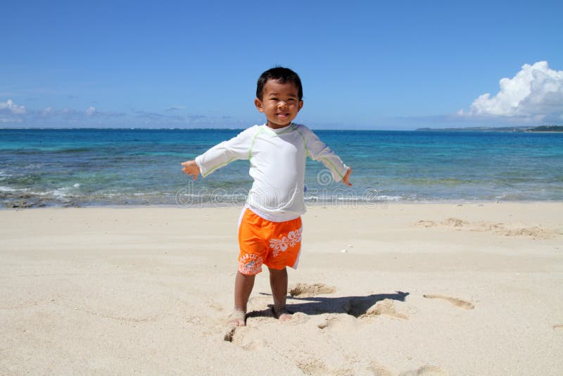 Japanese boy on the beach stock photo. Image of ocean 47672026