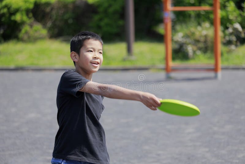 Japanese Boy Playing Flying Disc Stock Photo Image of elementary