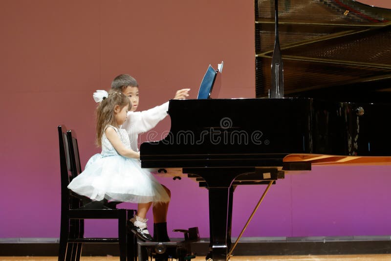 Sister play piano