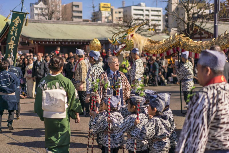 Japanese children in kimono walking during the festival of Asakusa.