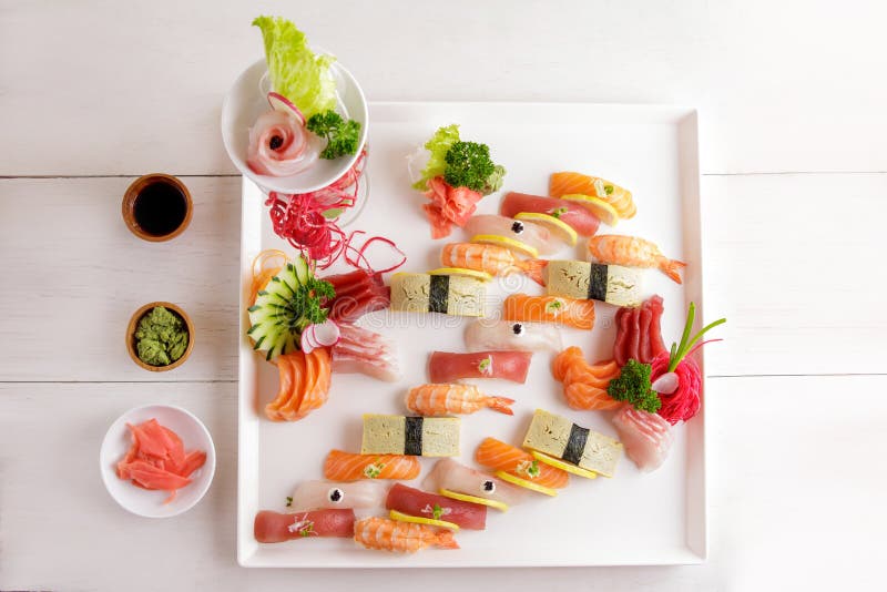 OKAMI Japanese Restaurant - Try the Sushi & Sashimi Platter! Rich  assortments of traditional Japanese sushi rolls, nigiris and sashimi. #okami  #okamirestaurant #sashimi #sushi #sushi #nigiri #teriyakichickenroll  #cookedtunaroll #tempuraprawnroll