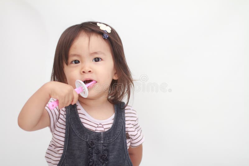 Japanese girl brushing her teeth