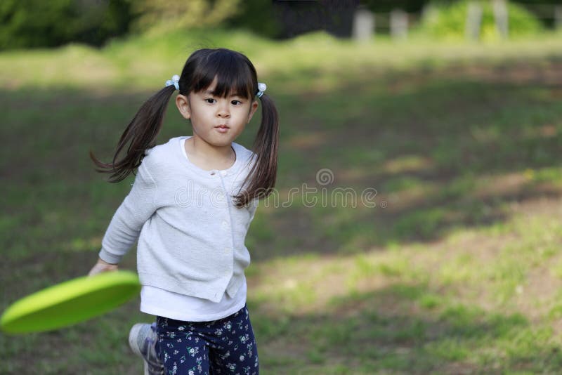 Japanese Girl Playing Flying Disc Stock Photo Image of girl, person