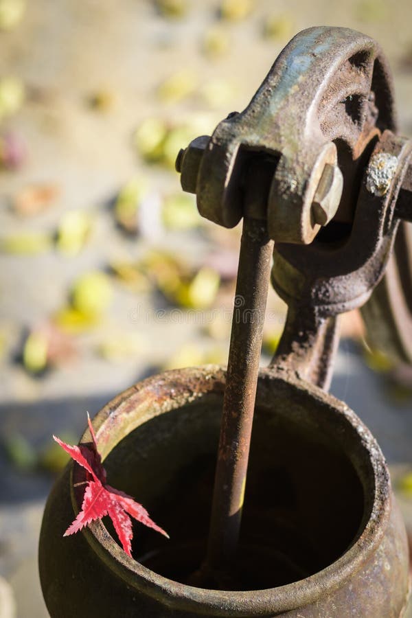 Old fashion outdoor well hand water pump Stock Photo - Alamy