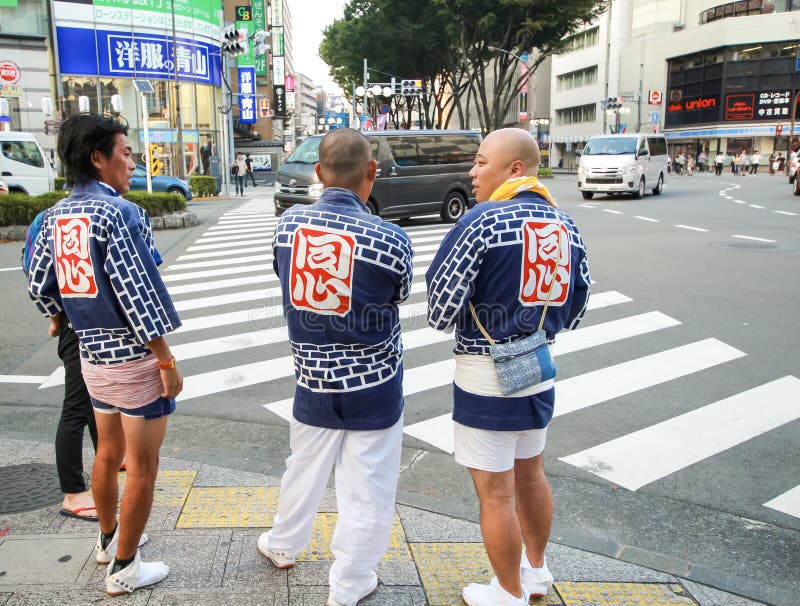 3 Japanese Men Wearing Traditional Clothing for Summer Festivals Standing  at a Crossing in Tachkikawa. the Robe-like Vest they are Editorial Image -  Image of dress, event: 188120600