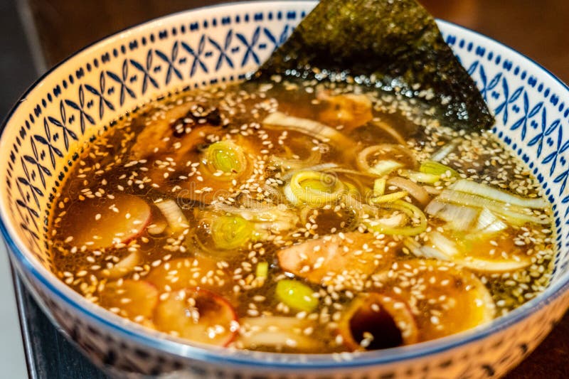 Japanese Miso Soup with Vegetables in Bowl on the Table Stock Photo
