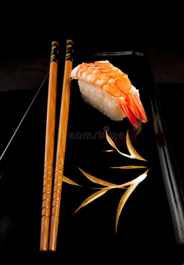 Japanese Nigiri Sushi, Chopsticks, Black Plate. Stock Photo Image of