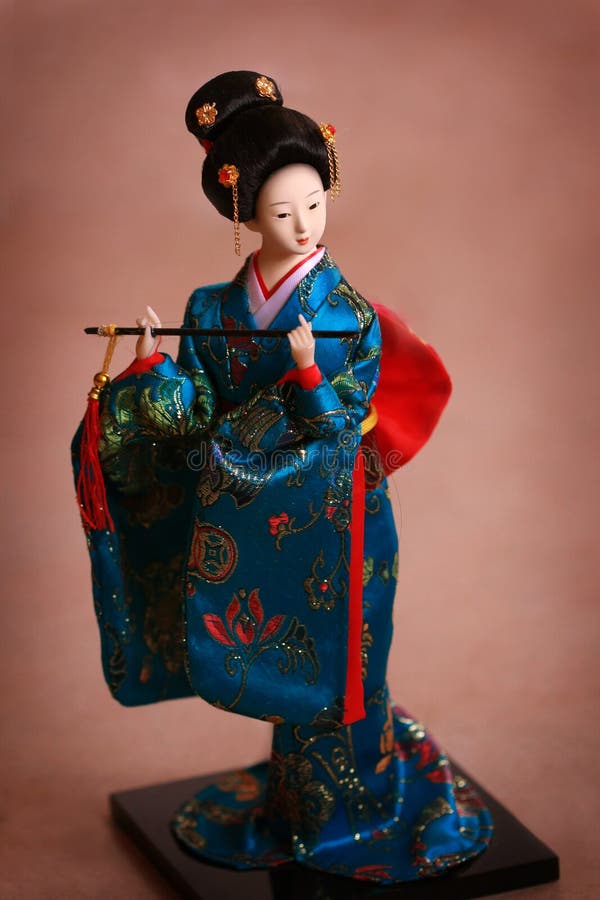 Japanese porcelain doll in blue kimono