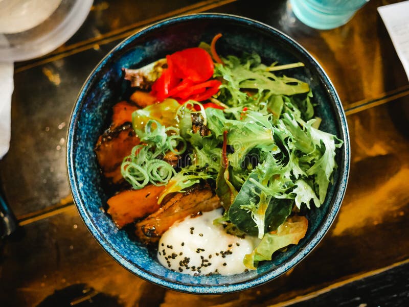 Japanese Ramen with Spoiled Egg and Fried Pork and Vegetables Bowl