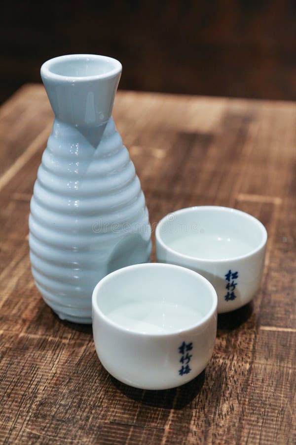 Japanese Sake Traditional Alcoholic Dring Set with Two Full Cups Stock