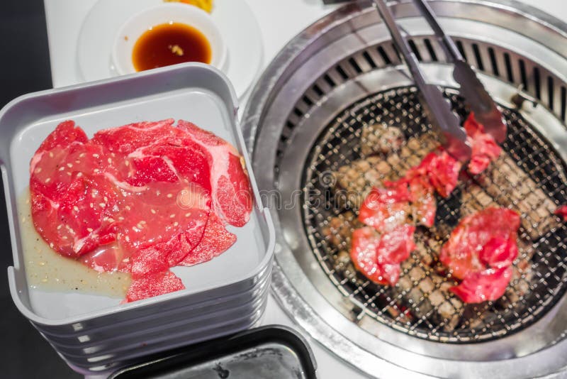 Japanese Style Raw Fresh Beef on Hot Barbecue Grill . Stock Image