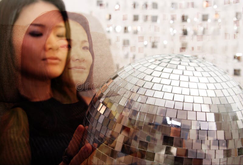 Japanese woman holds glitterball