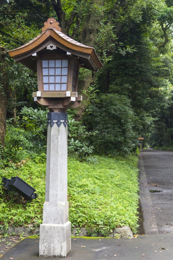 Japanese wood lantern and stone pole in Meiji Jingu Shrine, str royalty free stock photo Japanese wood lantern and stone pole in Meiji Jingu Shrine, str royalty free stock photo