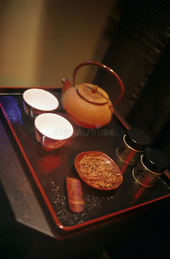 Japanese teapot and bowls on a tray. Japanese teapot and bowls on a tray