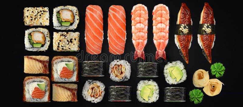 Japansk kokkonst Sushi- och rulluppsättning över mörk bakgrund arkivbilder Japansk kokkonst Sushi- och rulluppsättning över mörk bakgrund arkivbilder