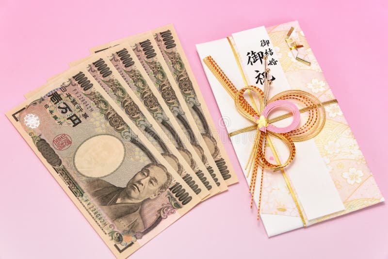 Japanese gift envelope and Ten thousand yen bill. Japanese traditional congratulation envelopes. Japanese gift envelope and Ten thousand yen bill. Japanese traditional congratulation envelopes.