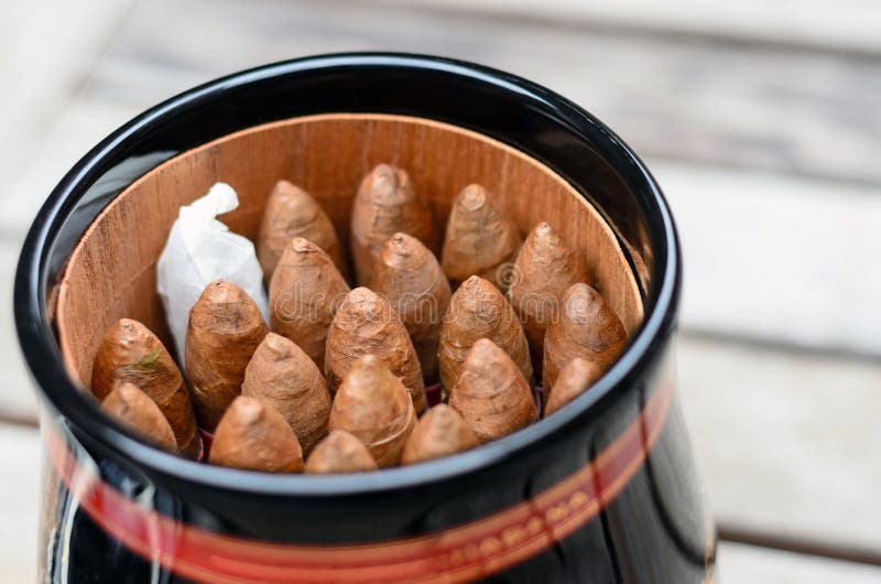 A jar of Cuban pyramid cigars stock images A jar of Cuban pyramid cigars stock images