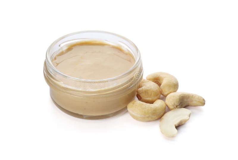 Jar with delicious cashew butter and nuts on white background