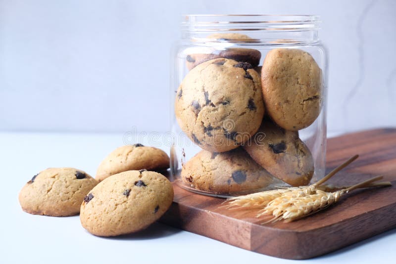 Jar Full of Chocolate Chip Cookies on Black Background Stock Image