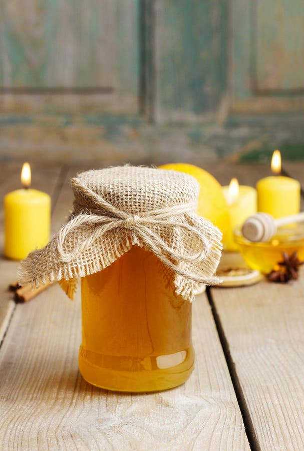Jar of Honey, Cinnamon Sticks and Candles Stock Image Image of gold