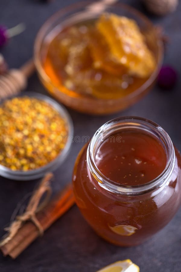 Jar of natural honey on table top view stock photography