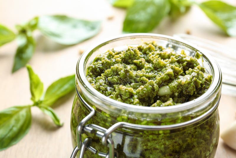 Jar of Tasty Pesto Sauce on Table, Closeup. Stock Photo Image of glass, delicious 146635280