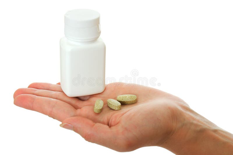 Jar of vitamins in the palm on a white background. Jar of vitamins in the palm on a white background.