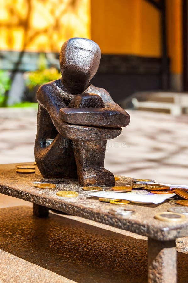 Jarnpojke or Iron Boy known as the little boy who looks at the moon is a sculpture in Gamla stan, Old Town, by Liss Eriksson is stock images Jarnpojke or Iron Boy known as the little boy who looks at the moon is a sculpture in Gamla stan, Old Town, by Liss Eriksson is stock images