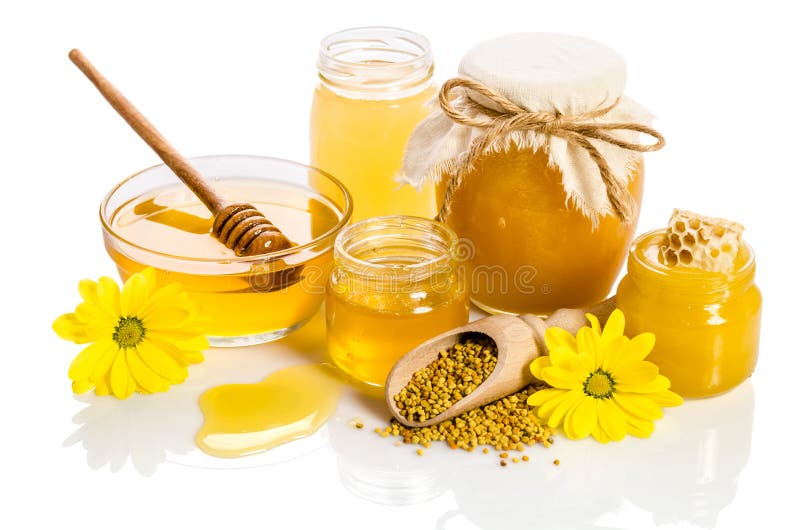 The jars of honey with honeycombs, glass bowl with honey