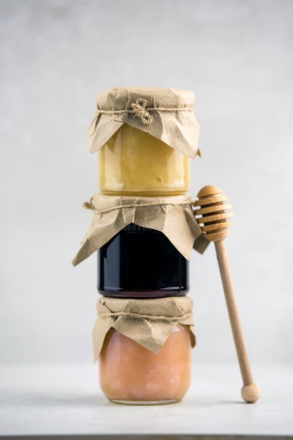Jars of Honey and Jams on Top of Each Other, Honey Dipper, Vertical