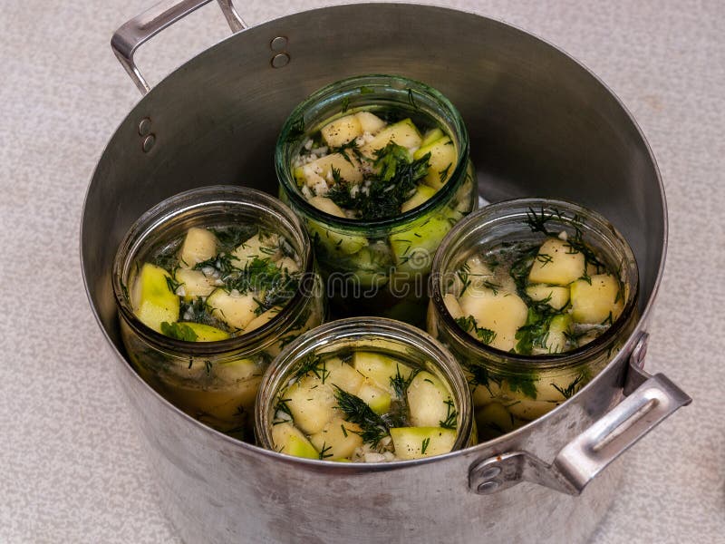 Jars of Vegetables in a Large Aluminum Pan. Pasteurization of Canned