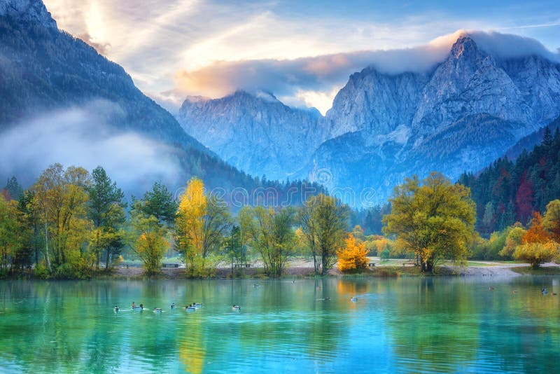 Jasna lake in Triglav national park at sunrise, Kranjska Gora, Slovenia. Amazing autumn landscape with Alps mountains