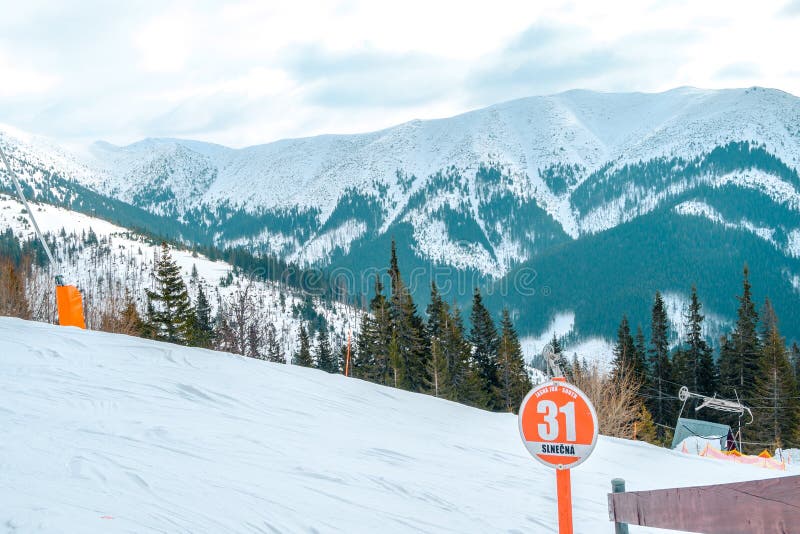 Jasna resort, LIPTOV, SLOVAKIA - February, 2019: Blue sky with snow clouds and new modern lift Funitel in Jasna, Liptov