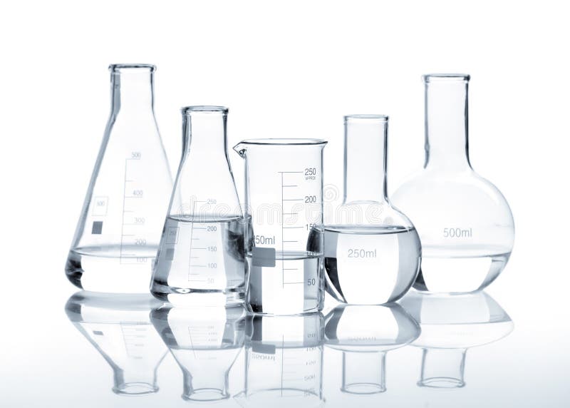 Five glass flasks with a clear liquid, isolated. Five glass flasks with a clear liquid, isolated